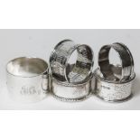 A group of five hallmarked silver serviette rings, wt. 5oz.