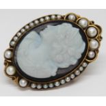 A pendant brooch featuring an oval cameo doublet and surrounded by cultured pearls, marked '585',