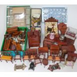 A box of dolls house furniture and effects.