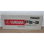 A Yamaha PS-3 keyboard in original box.