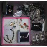 A quantity of costume jewellery including items marked '925', also with various badges.