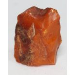 A butterscotch amber nugget, length 6cm, wt. 38.50g.