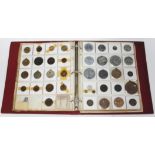 An album comprising GB and world, coins, tokens and medallions.