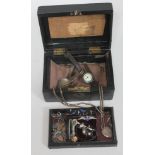 A jewellery box and contents including two hallmarked silver fobs, an RAF badge marked 'Silver', a