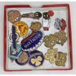 A box of collectable badges including Max Factor, Dodge, Butlins, automobile, Girl Guides etc.