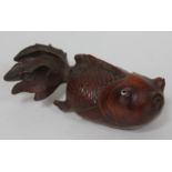 A Japanese carved wooden carp with glass eyes, length 15cm.