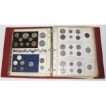 An album of GB and world coins, mainly proof sets, mid 20th century.
