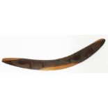 An Australian carved wood boomerang, length 64cm.