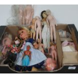 A box of vintage dolls, together with soft bodies for doll making.