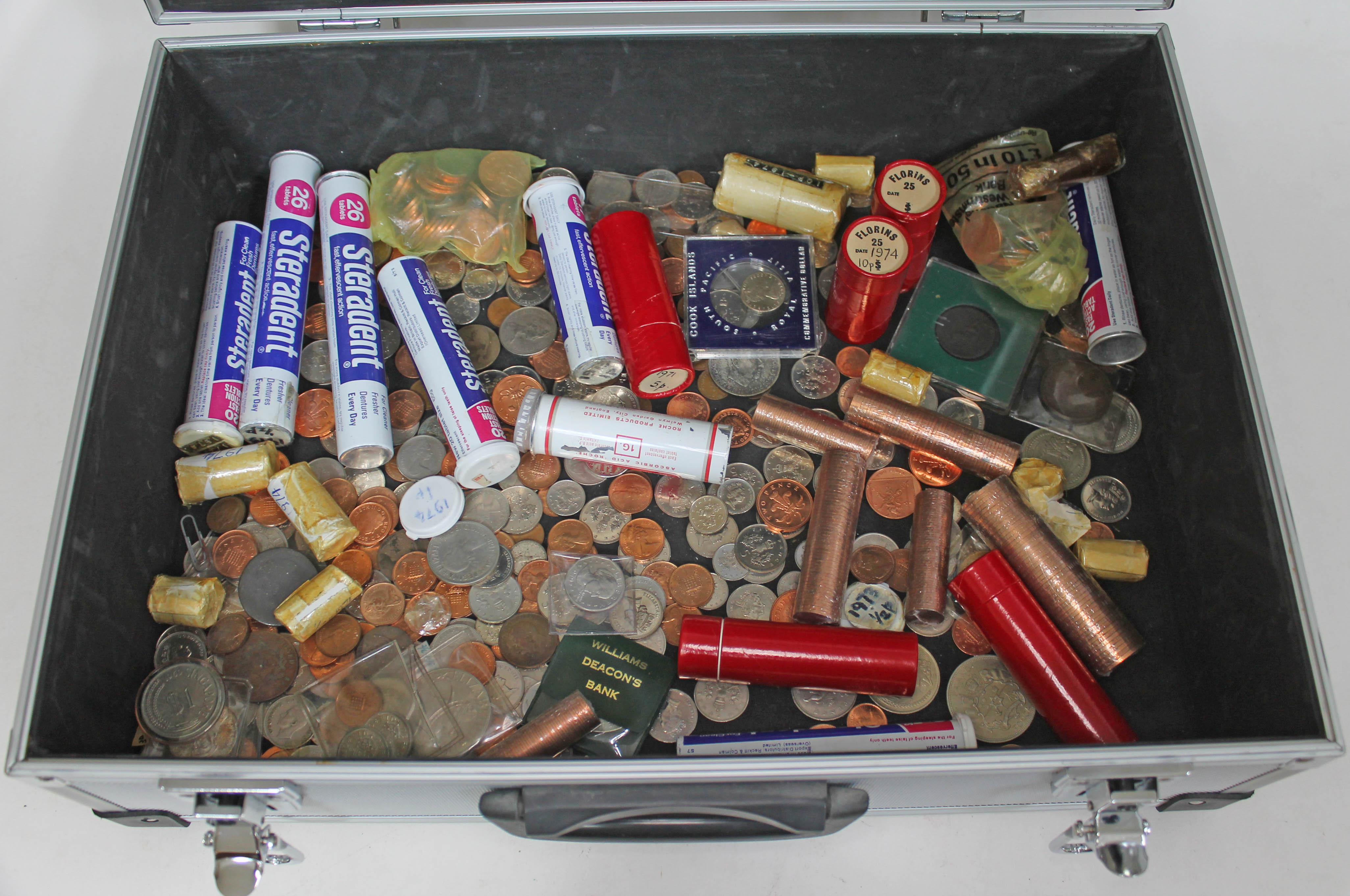 A hard case containing mainly Elizabeth II milled coins.