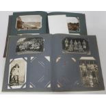 Two early 20th century postcard albums.