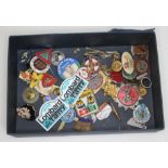 A box of various vintage badges.