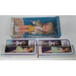 Two Victoria Jane 11.5" dolls, in original packaging, together with a 14" "I'm Miss Ranella" doll in