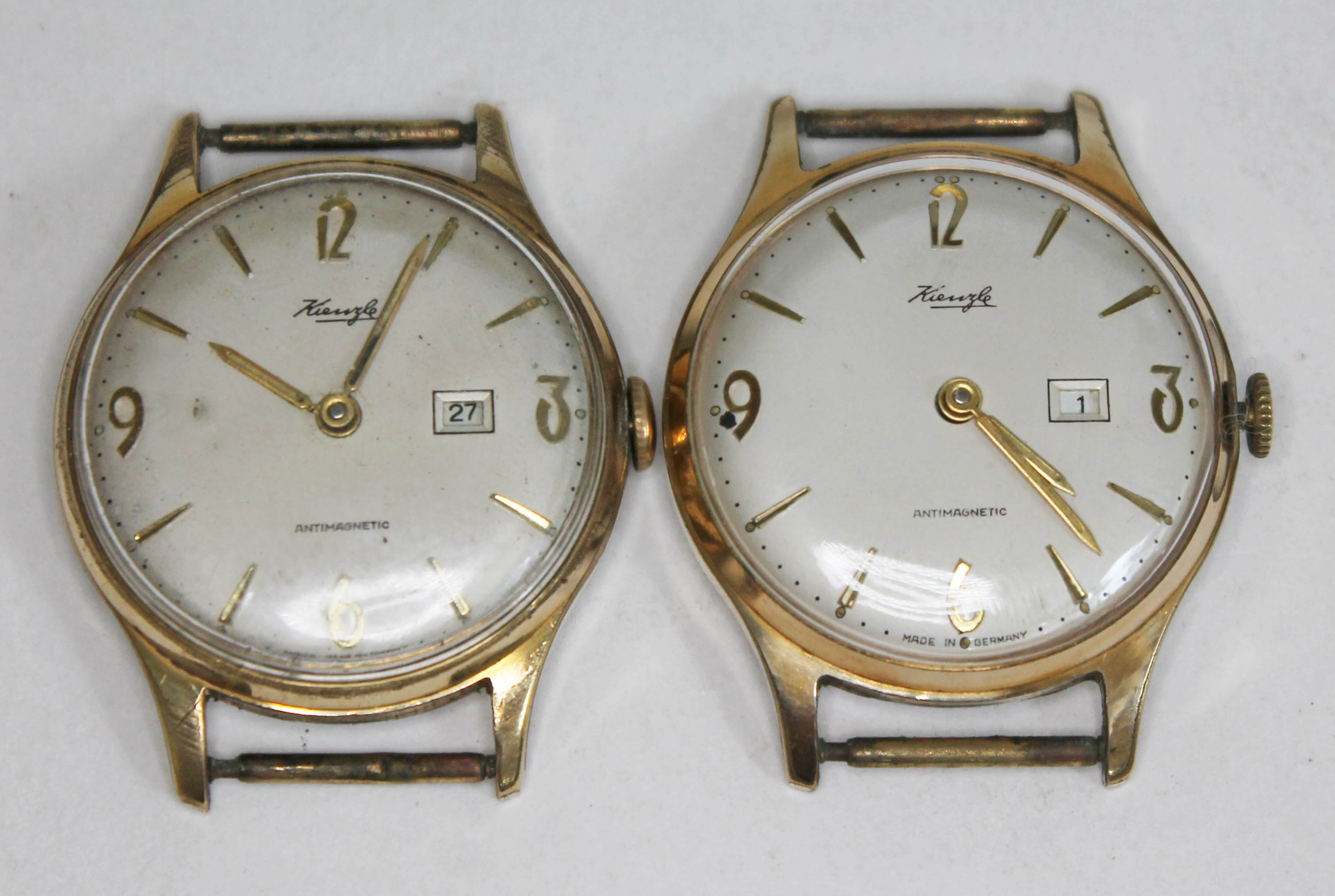 A pair of Kienzle gold plated wristwatches.
