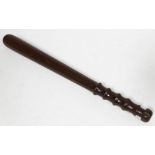 A lignum vitae police truncheon, length 42cm.