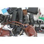 A quantity of vintage cameras and accessories.