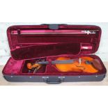 A Prima Loreato student violin with hard case including bow and accessories.