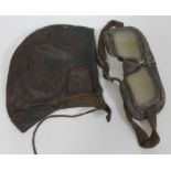 A vintage leather flying helmet and goggles.