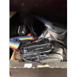 A box of cameras including Olympus video camera, Sharp Viewcam, etc