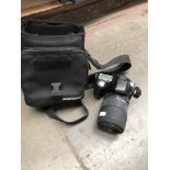 A Pentax ISTD L2 digital SLR camera and bag