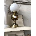 Brass oil llamp with milk glass shade