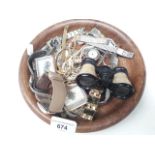 A wooden bowl with wristwatches, costume jewellery, etc