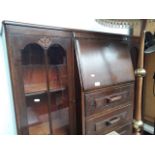 A 1930s oak bureau display cabinet.