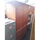 A pine linen press style wardrobe.