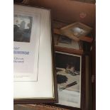 A box of pictures and frames