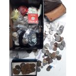 A box of various world and British coins, first day covers, etc.