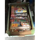 A box of vintage household magazines