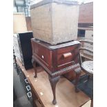 A vintage sewing box and an old upholstered top box.