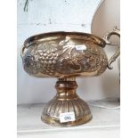 A twin handled brass dish on pedestal base