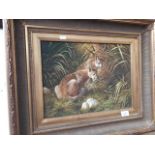 An oil on board, tiger cubs hiding in grass, signed Woodcock, approx size 40 x 30 cm, in gilt