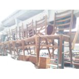 A set of six retro ladder back and rush seated dining chairs.