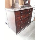 A Georgian mahogany chest of drawers of small proportions.