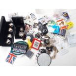 A mixed tub including costume jewellery, badges, keyrings etc