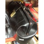 A black leather briefcase/doctors bag