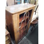 A figured walnut display cabinet.