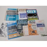 A collection of football programmes and tickets.