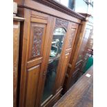 An Edwardian mirrored wardrobe.