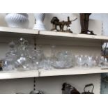 A collection of glasware to include decanters, bowls, vases and drinking glasses