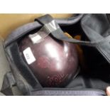 A bag containing two ten pin bowling balls, together with roller boots, flippers, toy cars etc