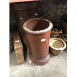 Two earthen ware chimney pots, a drain surround, a small trough and four pottery planters