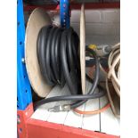 A drum of rubber air hose