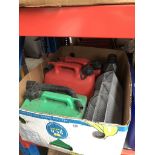 A box containing 3 plastic petrol cans