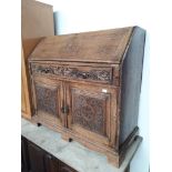 A late Victorian carved oak bureau, width 115cm, depth 52cm & height 108cm.