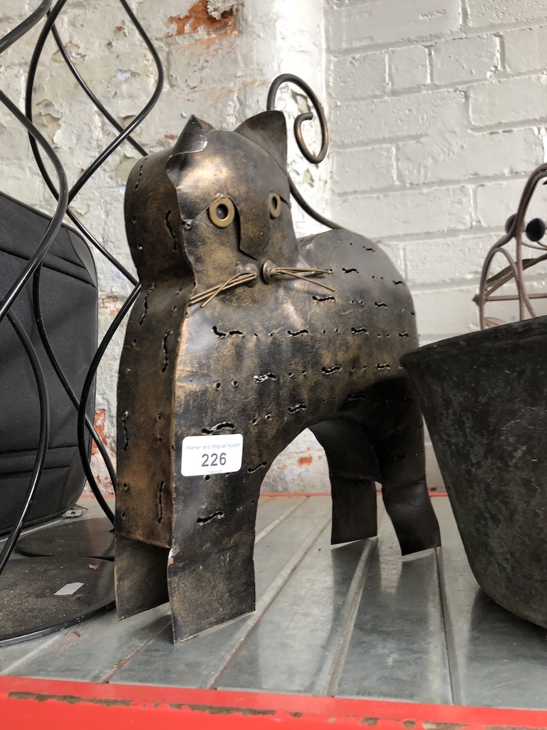 A metal cat candle holder