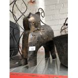 A metal cat candle holder