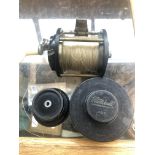 A fishing reel and spare spools